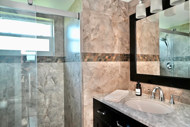 bathroom with vanity and walk in shower