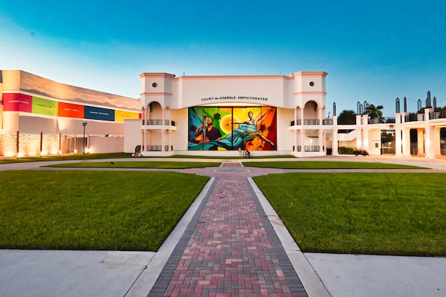 view of outdoor building at dusk