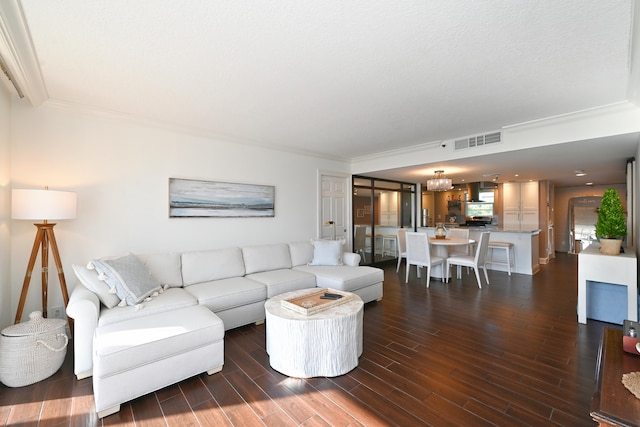 living room featuring crown molding and dark hardwood / wood-style floors