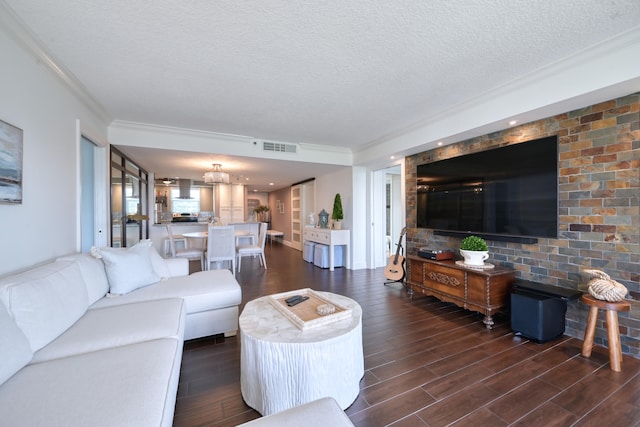 living room featuring brick wall, a textured ceiling, and dark hardwood / wood-style floors