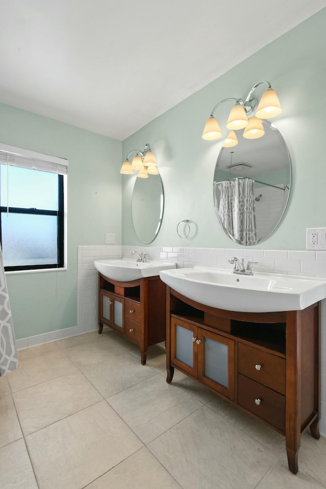 bathroom with vanity, tile patterned floors, and curtained shower