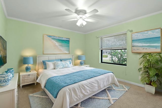 carpeted bedroom with ceiling fan and crown molding