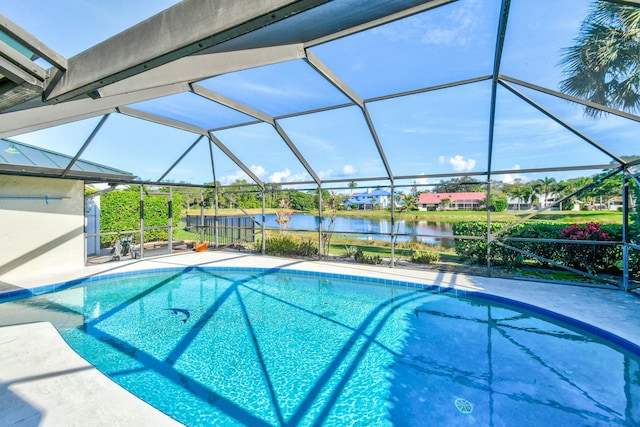 view of swimming pool featuring a lanai, a water view, and a patio