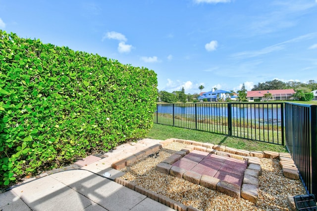 view of patio with a water view