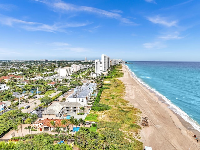 aerial view with a water view and a view of the beach