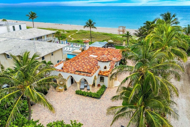 birds eye view of property featuring a water view and a view of the beach