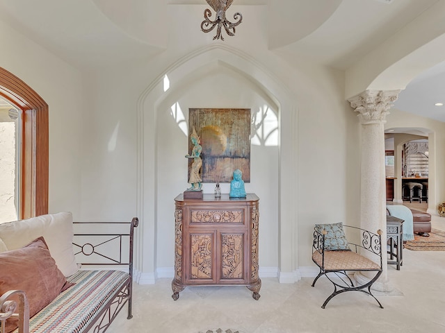 sitting room with decorative columns