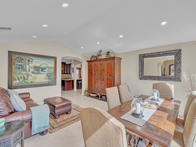 dining space featuring lofted ceiling