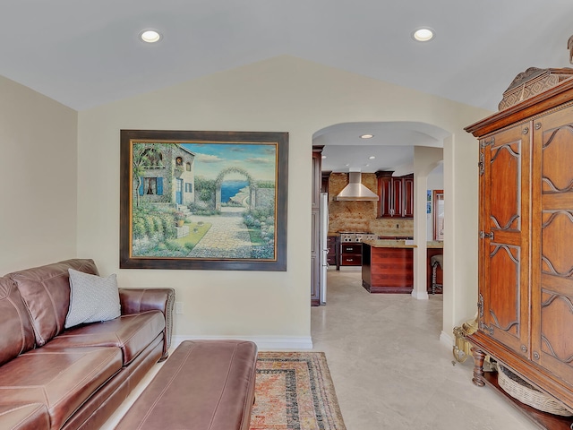 living room featuring lofted ceiling