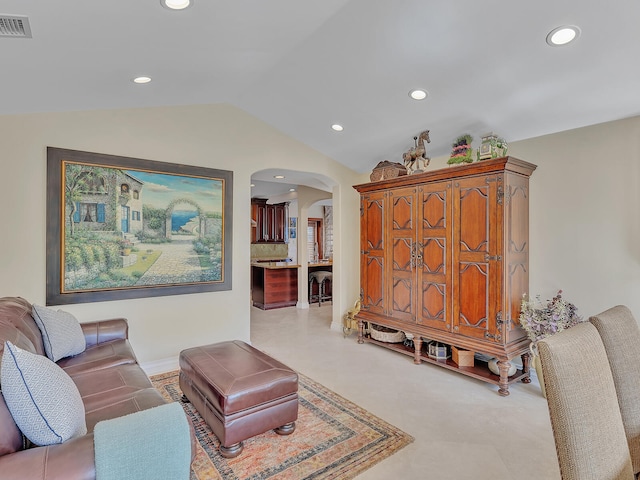 living room featuring vaulted ceiling