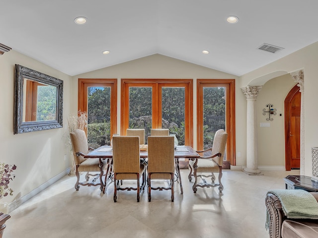 dining area featuring decorative columns and lofted ceiling