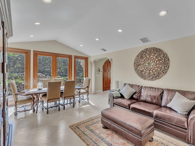 living room featuring vaulted ceiling