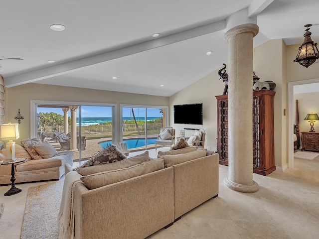 living room with ornate columns, lofted ceiling with beams, and a wealth of natural light