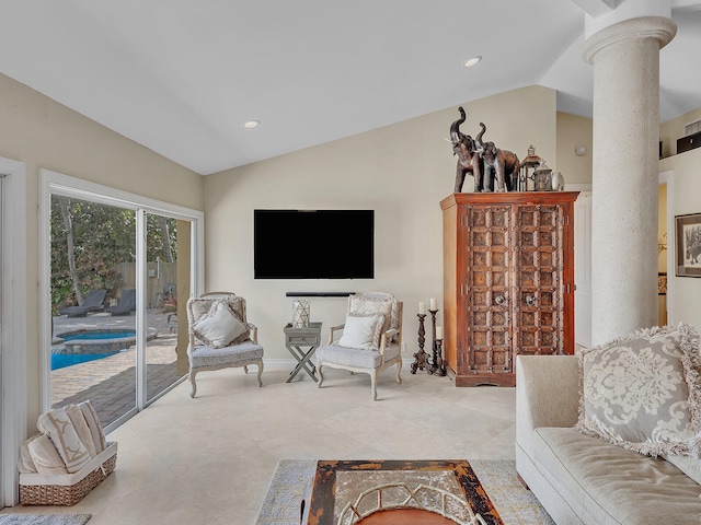 living room featuring decorative columns and lofted ceiling