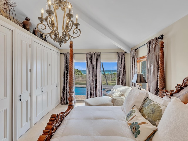 carpeted bedroom with lofted ceiling with beams, access to exterior, and a chandelier