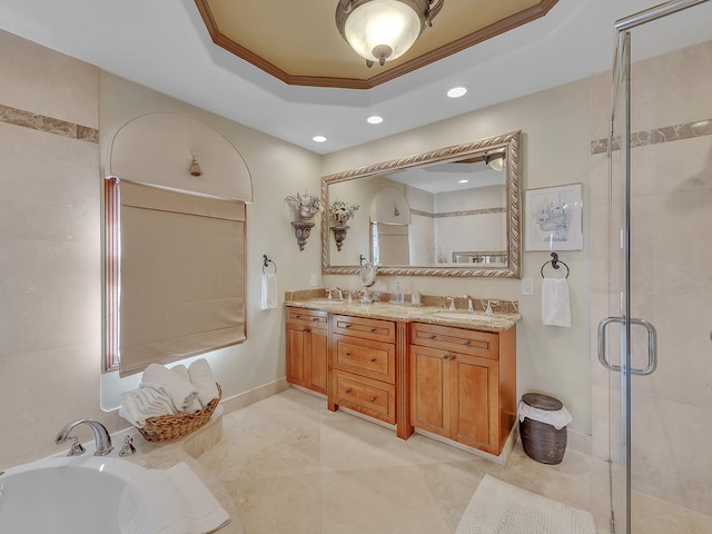 bathroom featuring a raised ceiling, plus walk in shower, crown molding, and vanity