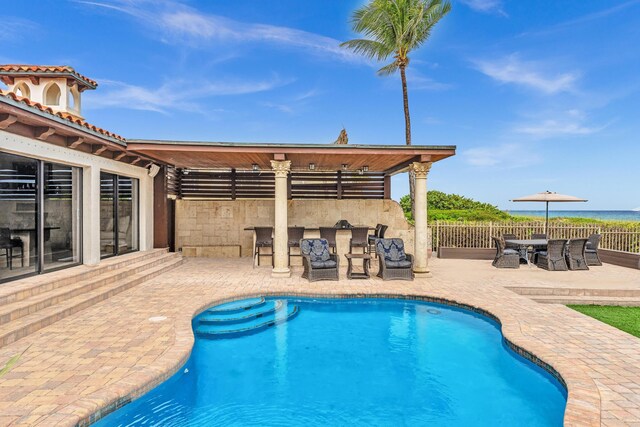 view of swimming pool featuring a patio area