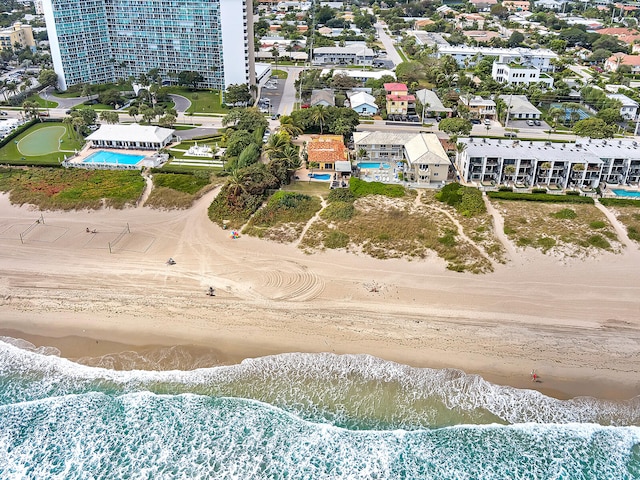 drone / aerial view featuring a view of the beach and a water view