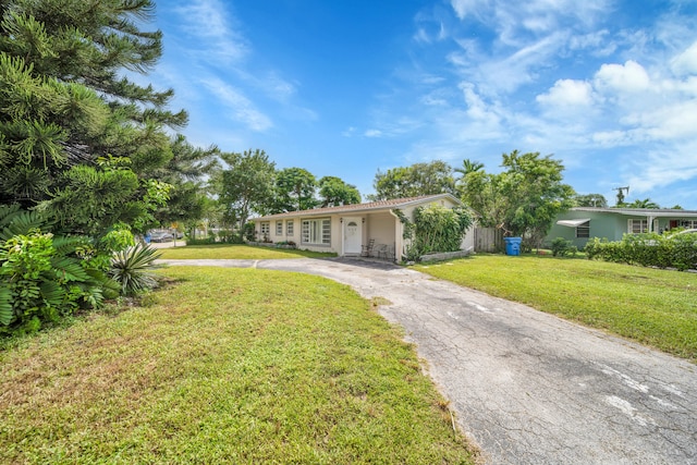 ranch-style house with a front yard