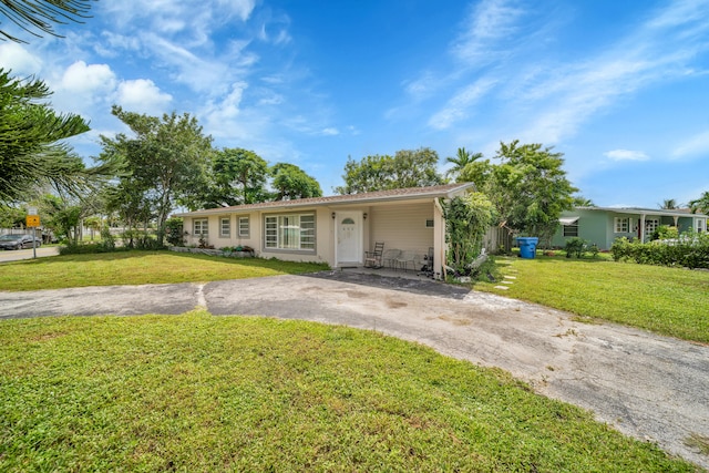 ranch-style home with a front yard