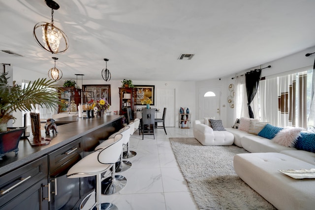 living room with a notable chandelier