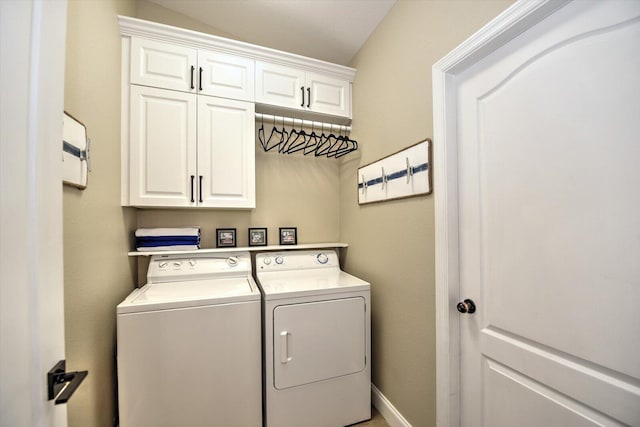 laundry area featuring cabinets and washer and dryer