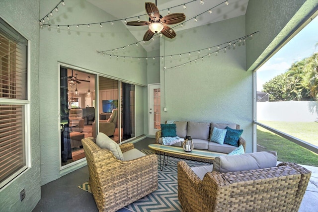 exterior space with an outdoor living space and ceiling fan