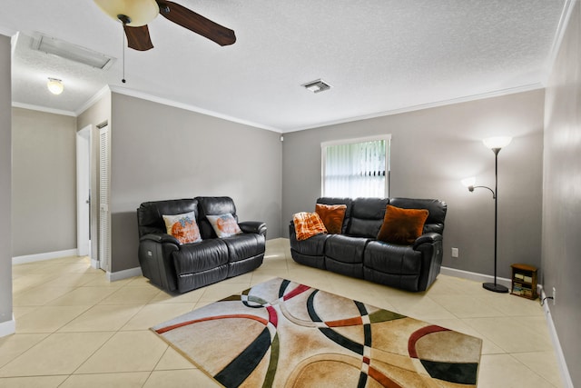 tiled living room featuring ceiling fan, a textured ceiling, and ornamental molding