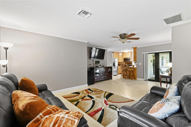 tiled living room featuring crown molding and ceiling fan