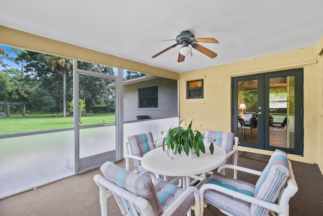 sunroom / solarium with ceiling fan and a wealth of natural light