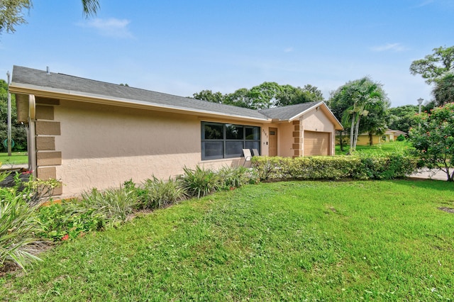 view of home's exterior featuring a yard and a garage