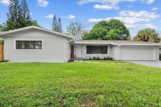 ranch-style home with a front yard and a garage