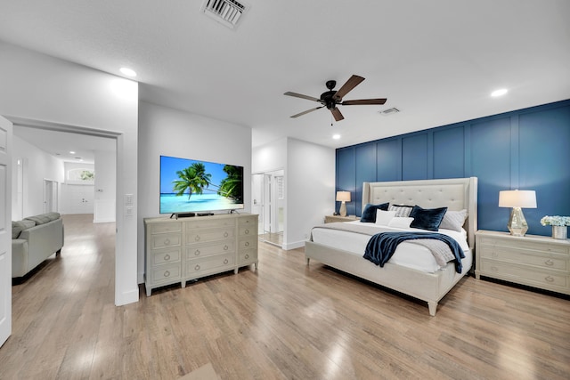 bedroom featuring light hardwood / wood-style flooring and ceiling fan