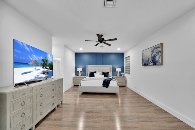 bedroom featuring ceiling fan and light hardwood / wood-style floors