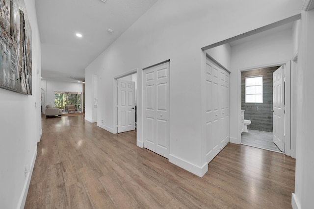 hall with light hardwood / wood-style flooring