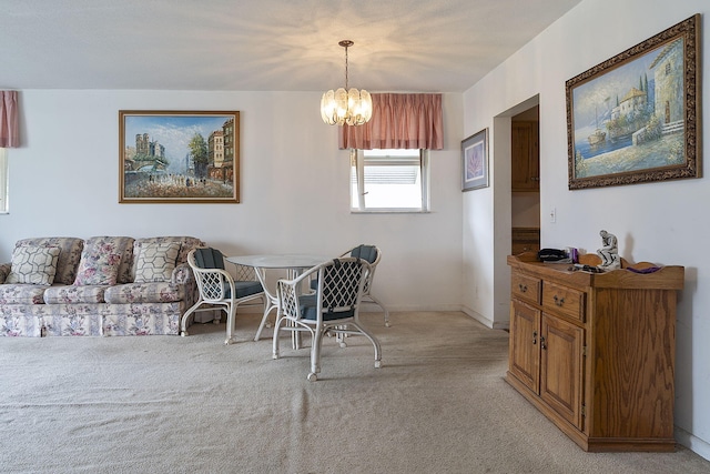 carpeted dining area with a chandelier