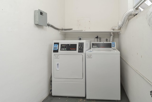 clothes washing area featuring washer and dryer