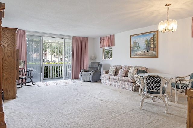 carpeted living room with an inviting chandelier and a textured ceiling