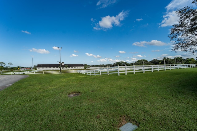 view of yard with a rural view