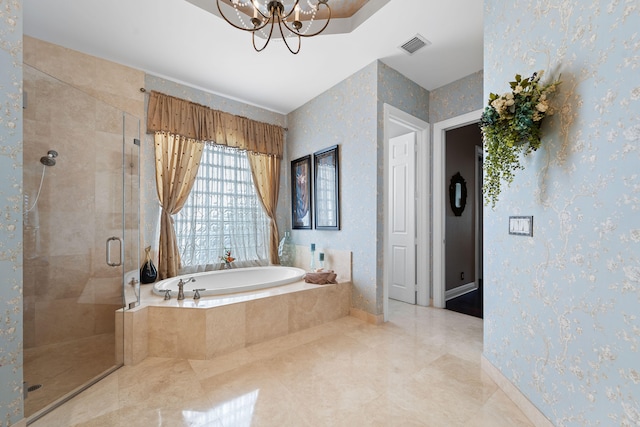 bathroom featuring a notable chandelier and plus walk in shower