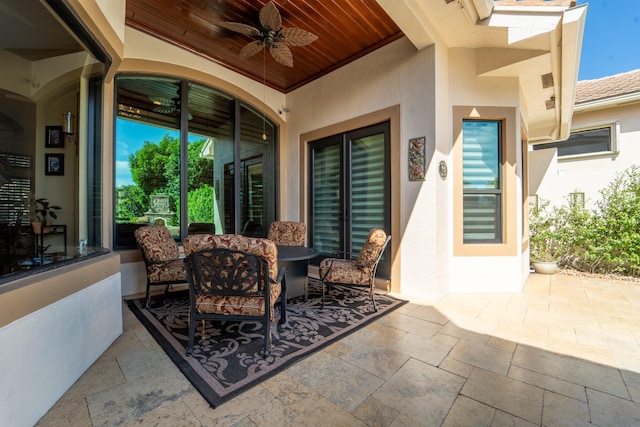 view of patio featuring ceiling fan