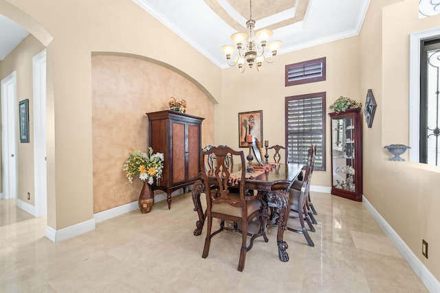 dining room featuring ornamental molding and a chandelier