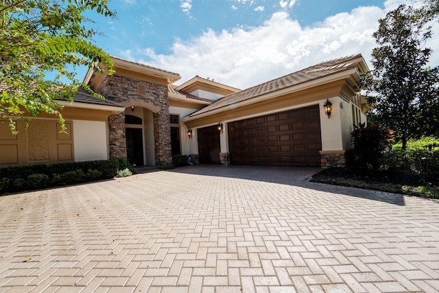 view of front of home with a garage