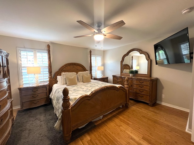 bedroom with ceiling fan and wood-type flooring