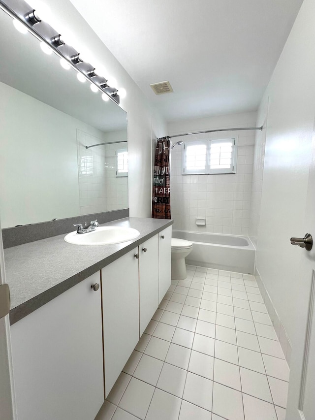 full bathroom with vanity, shower / tub combo with curtain, toilet, and tile patterned floors