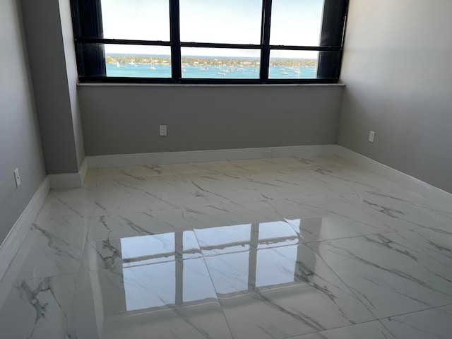 empty room featuring a water view