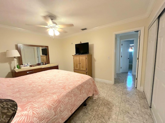 bedroom featuring ceiling fan, a closet, and ornamental molding