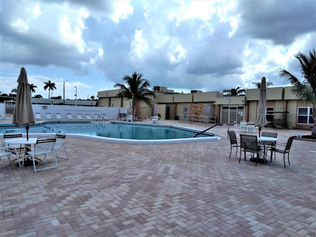 view of pool featuring a patio