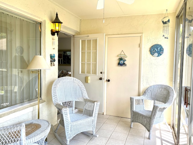 view of exterior entry with ceiling fan