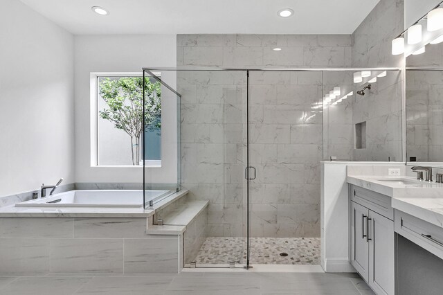 10125 Driftwood Way, Palm Beach Gardens, FL 33412 - full bath with a bath, vanity, a stall shower, marble finish floors, and recessed lighting